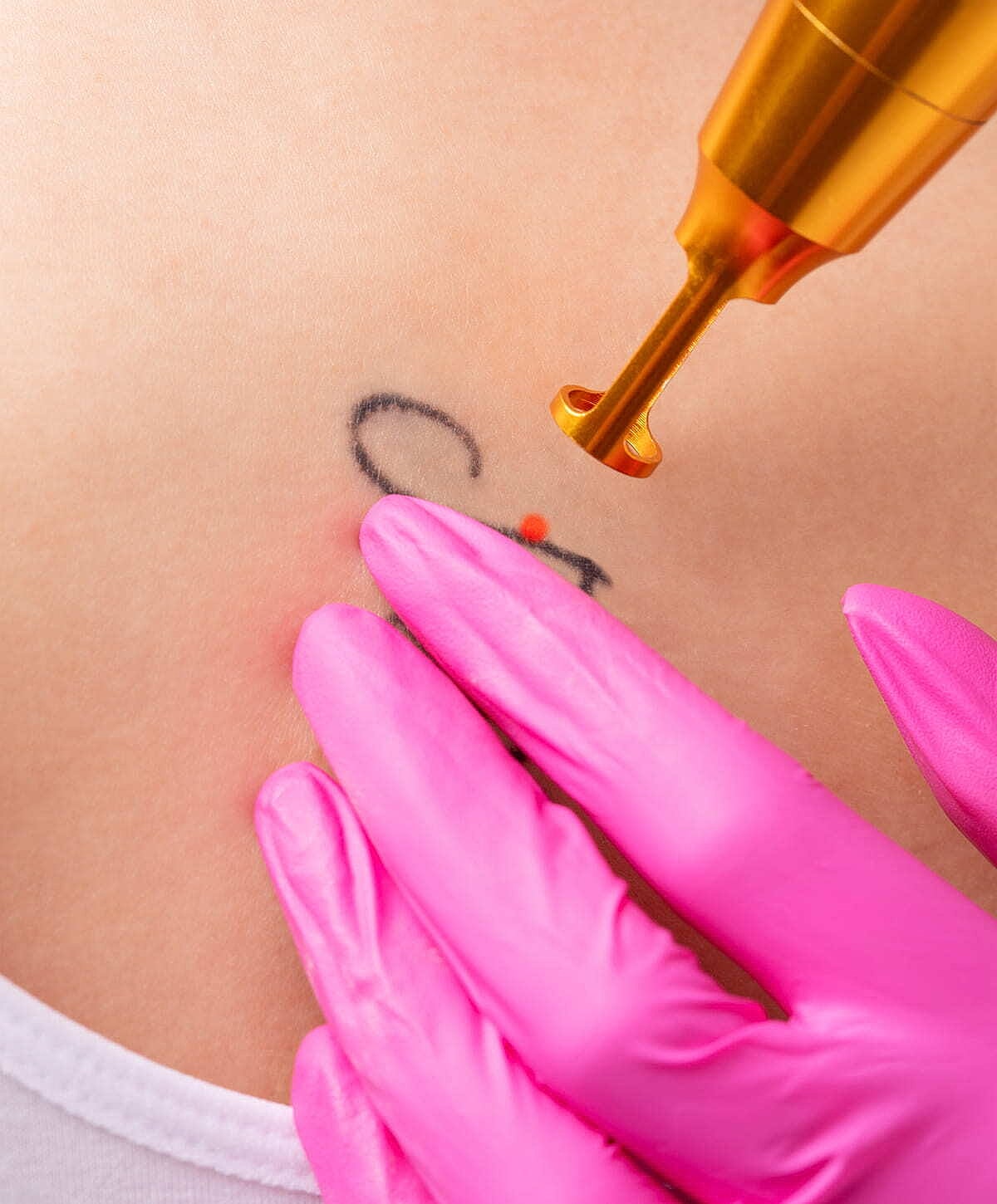 Model posing in sporty outfit indoors.