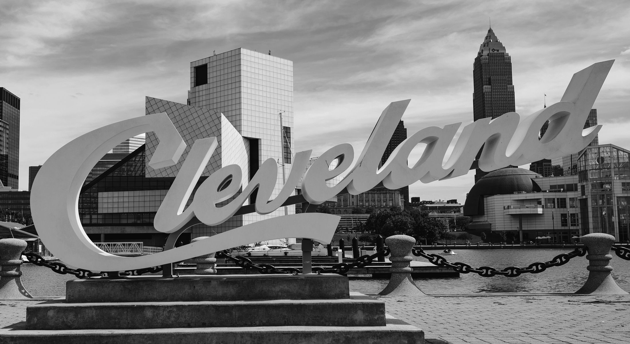 Cleveland sign with skyline in the background.