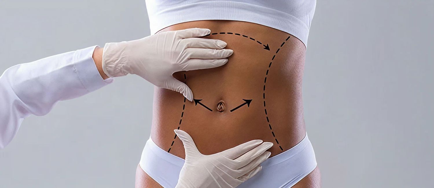 Medical professional examining a patient's abdomen.