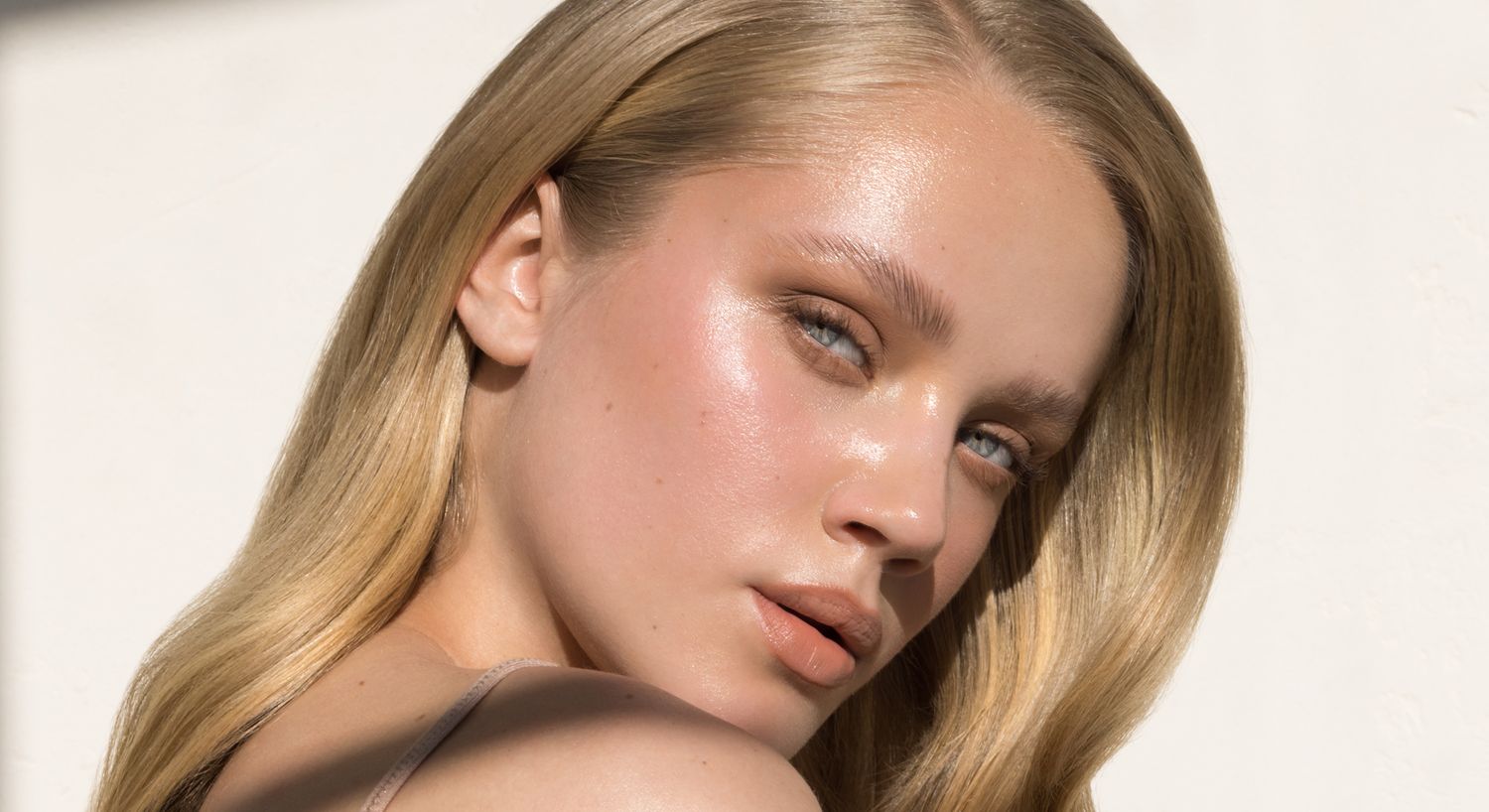 Portrait of a person with long blonde hair.